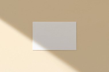 Bej arka planda gölgeli bir kartvizit modeli. 85x55 mm.