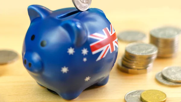 Australian piggy bank and coins savings concept, closeup. — Stock Photo, Image