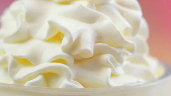 Macro closeup of swirls of whipped cream for cake decorating. — Stock Photo, Image