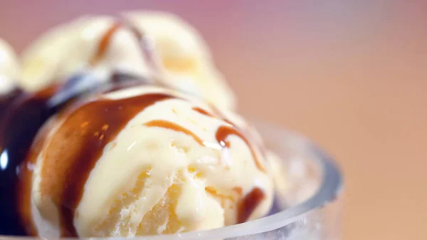 Vanilla ice cream macro closeup with chocolate sauce. — Stock Photo, Image