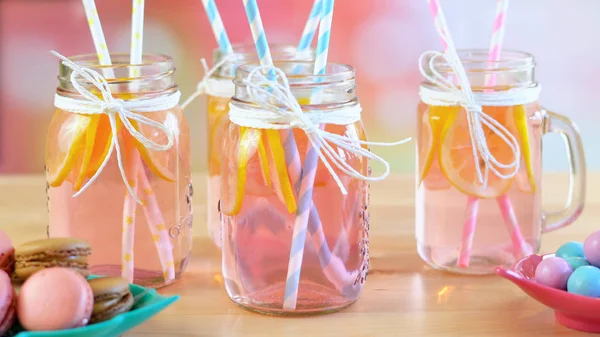 Part table with pink lemonade in mason jars closeup. — Stock Photo, Image