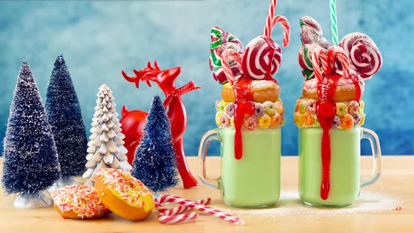 On trend festive Christmas freak shake milkshakes. — Stock Photo, Image