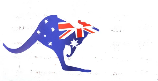 Kangaroo shaped Australian flag on white wood background. — Stock Photo, Image