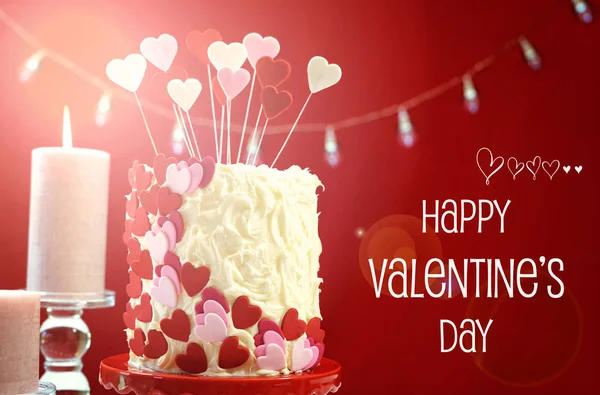 Valentines Day party table with showstopper hearts cake with lens flare. — Stock Photo, Image