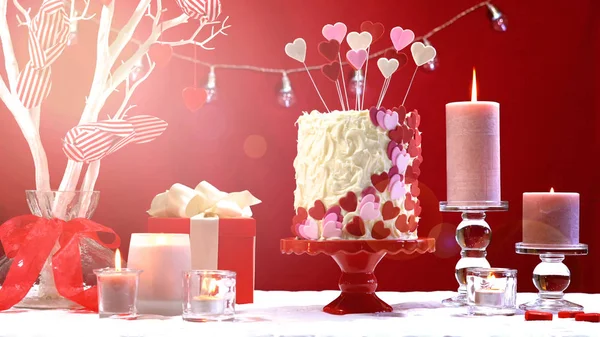 Valentines Day party table with showstopper hearts cake with lens flare. — Stock Photo, Image