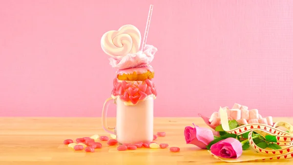 Valentines Day freak shakes with heart shaped lollipops and donuts. — Stock Photo, Image