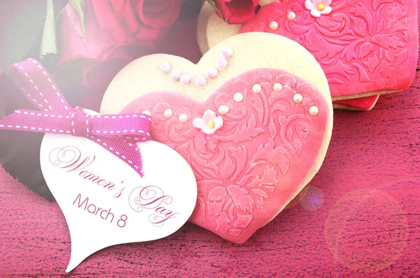 International Womens Day, March 8 with feminine cookies and lens flare. — Stock Photo, Image