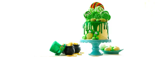 St Patricks Day theme lollipop candy land drip cake. — Stock Photo, Image