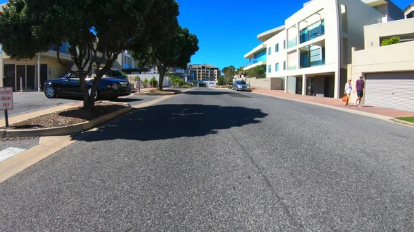 Vehicle POV of pedestrians and luxury car near Glenelg Marina, South Australia. — Stock Photo, Image