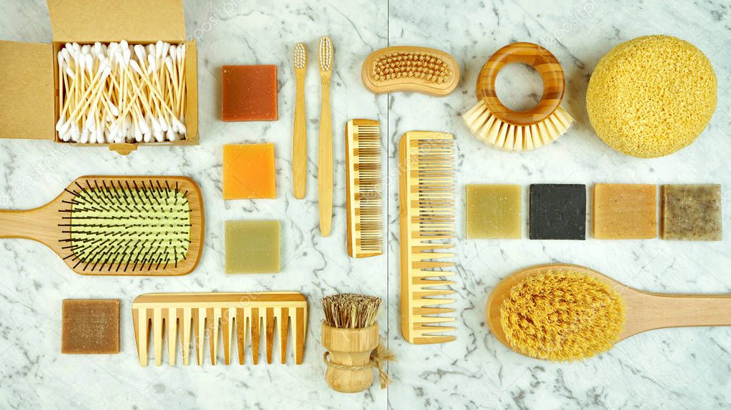 Zero-waste, plastic-free bathroom and personal household flatlay overhead.