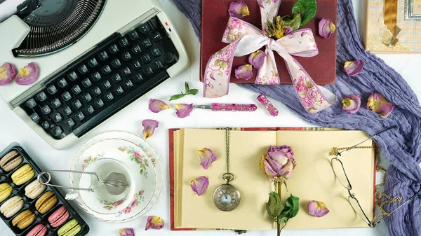 Romantic vintage feminine writing desk stop motion with old typewriter.