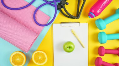 Modern renkli arka planda sağlık ve fitness konsepti.