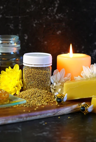 Honey and related products with closeup on jar of bee pollen. — Stock Photo, Image