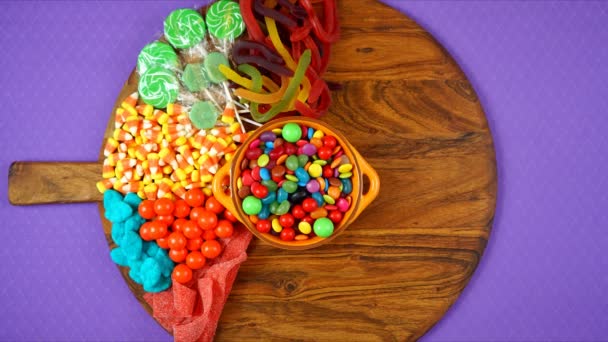 Halloween trick or treat candy grazing platter charcuterie board stop motion. — Stock Video