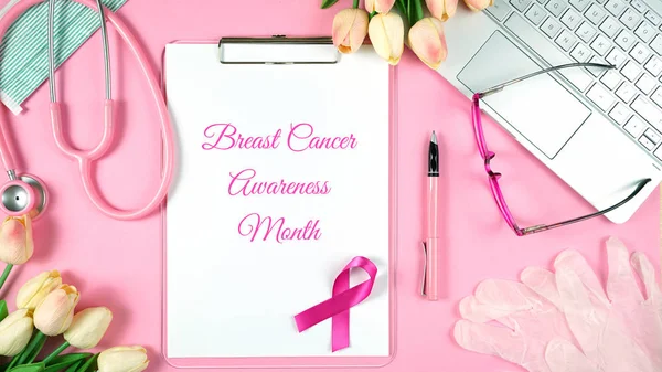 Pink Ribbon Breast Cancer Awareness Month doctors desk concept. — Stock Photo, Image