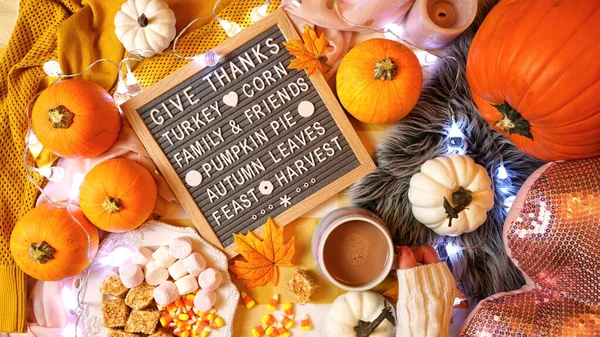 Thanksgiving in bed flatlay overhead with letter board Giving Thanks messsage.