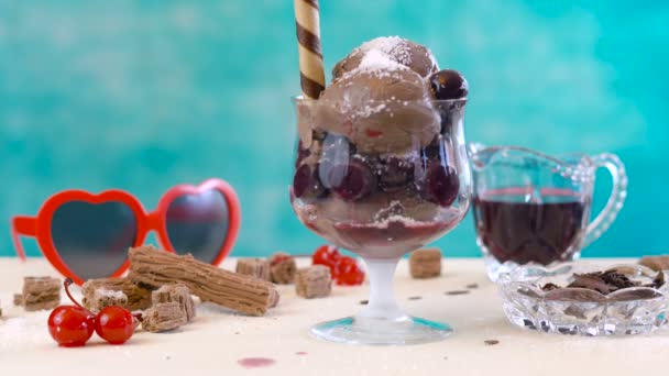 Making chocolate cherry and coconut ice cream sundaes. — Stock Video