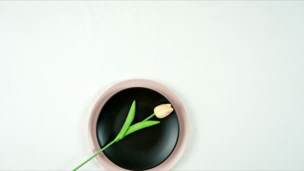 Modern pink, black and gold table place setting top view flat lay. — Stock Video