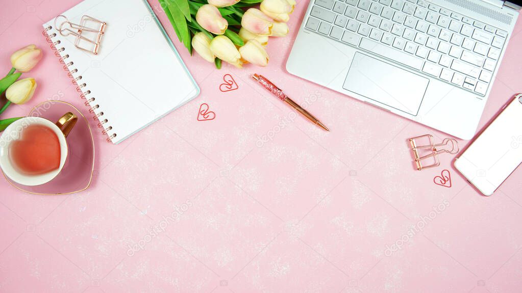 Feminine pink desktop workspace blog header overhead flat lay.