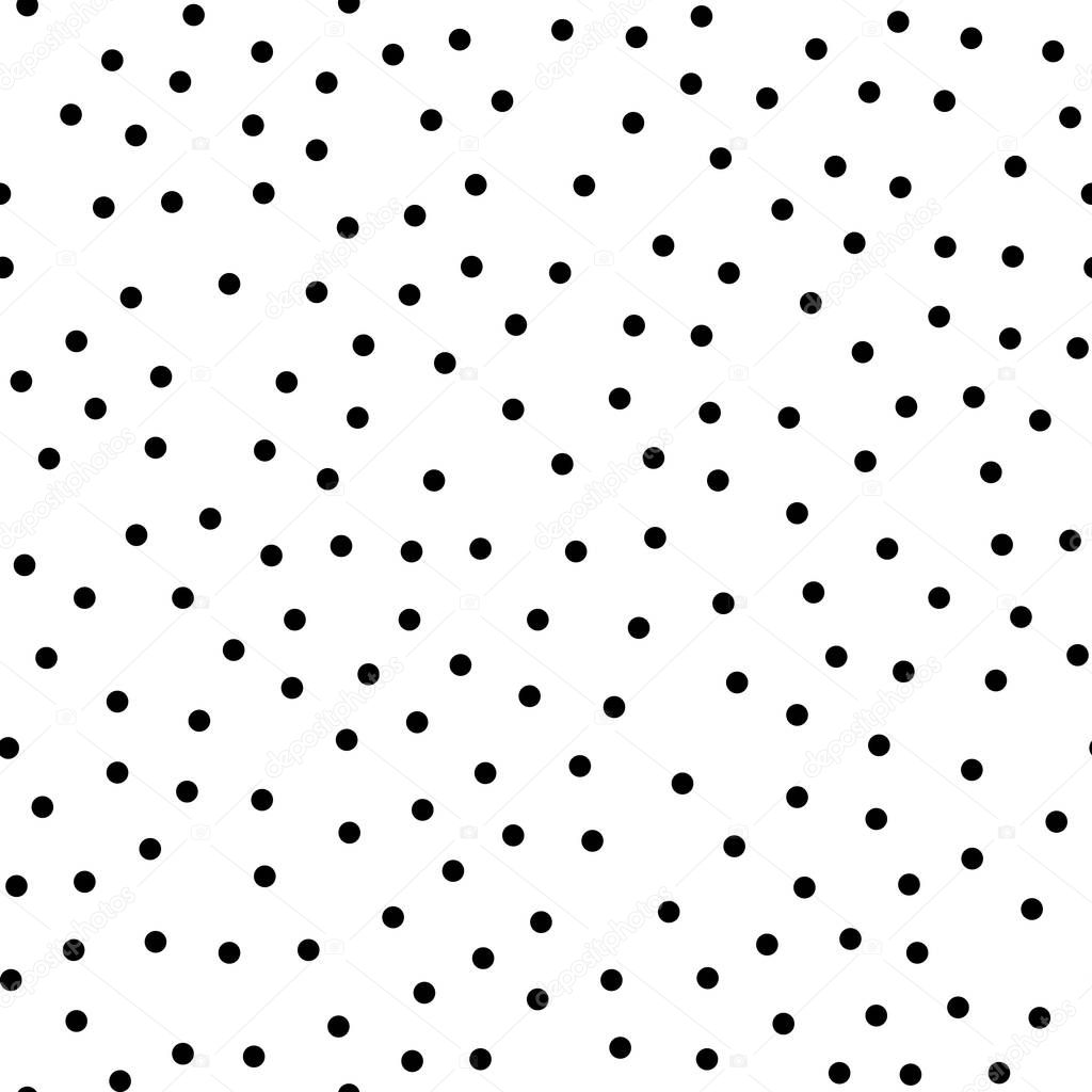 Random scattered polka dots, abstract black and white background.
