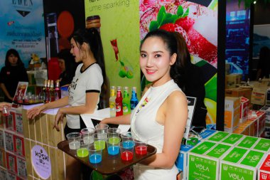 BANGKOK, THAILAND - JUNE 02, 2018: Unidentified female presenter pose in the THAIFEX - World of food asia 2018 on JUNE 02, 2018 in Bangkok, Thailand. clipart