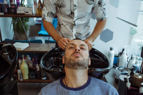 Men's haircut in barbershop