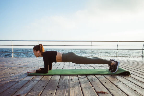 stock image Fitness woman doing push ups Outdoor training workout