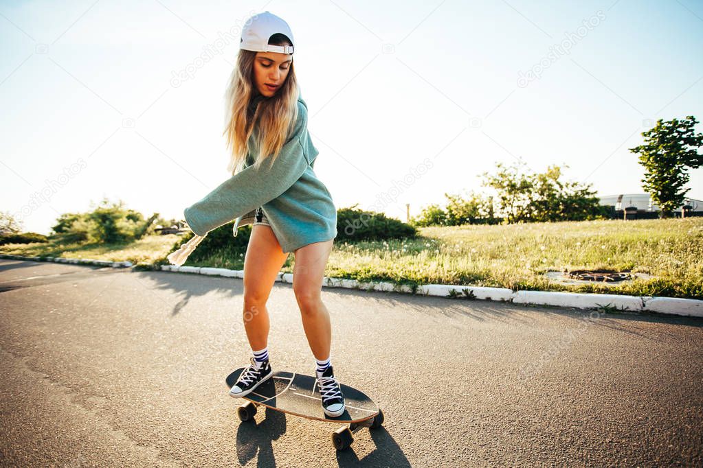 Hipster girl with skate board