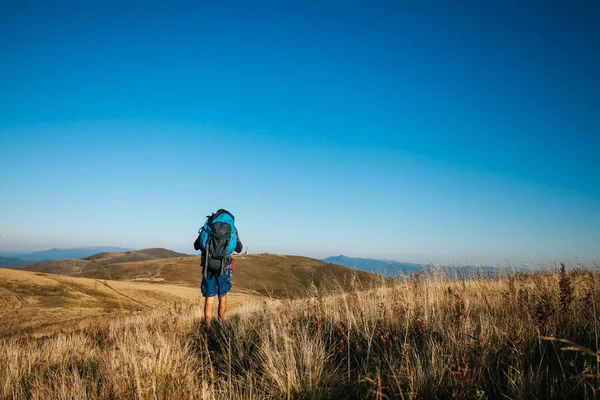 Man goes hiking in the mountains alone