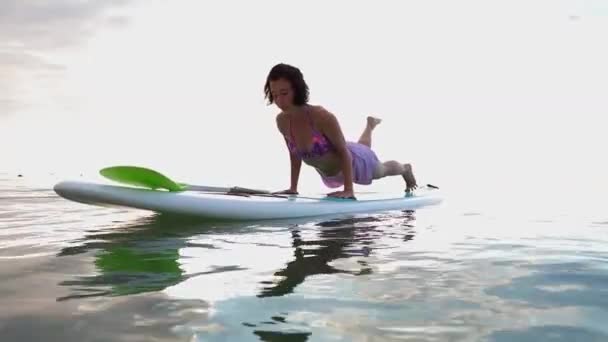 Young Woman Doing Yoga Sup Board Lake Sunrise — Stock Video