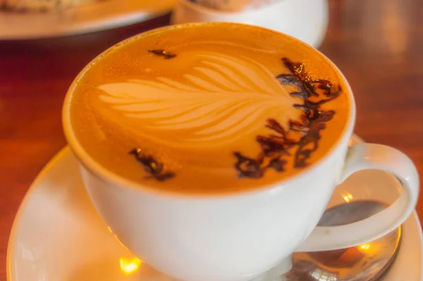 A beautiful cream pattern made on a coffee cup Coffee Mocha