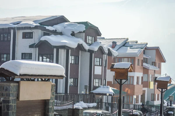 Snow over the roof tops of houses hotels in Gulmarg Kashmir