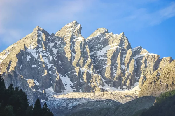 Sunrise on a snow-capped mountain peak. A mountain with a glacier in Sonmarg Kashmir