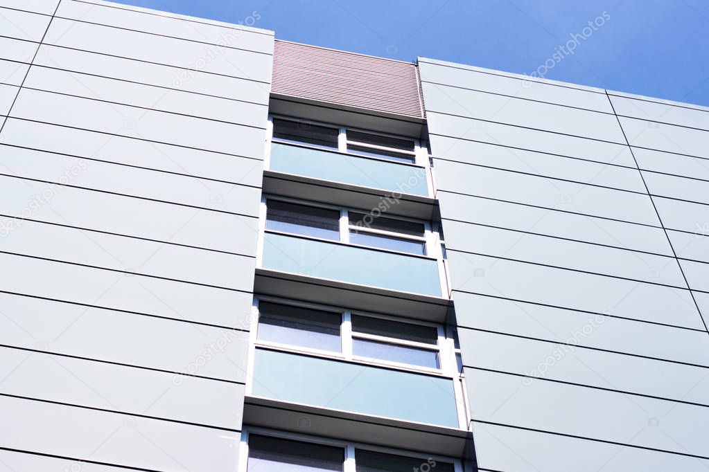 Facade of a modern apartment building. Blue Sky.