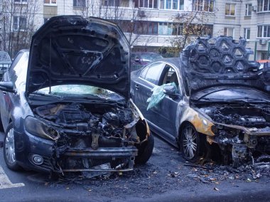 burnt cars in the yard in the morning clipart