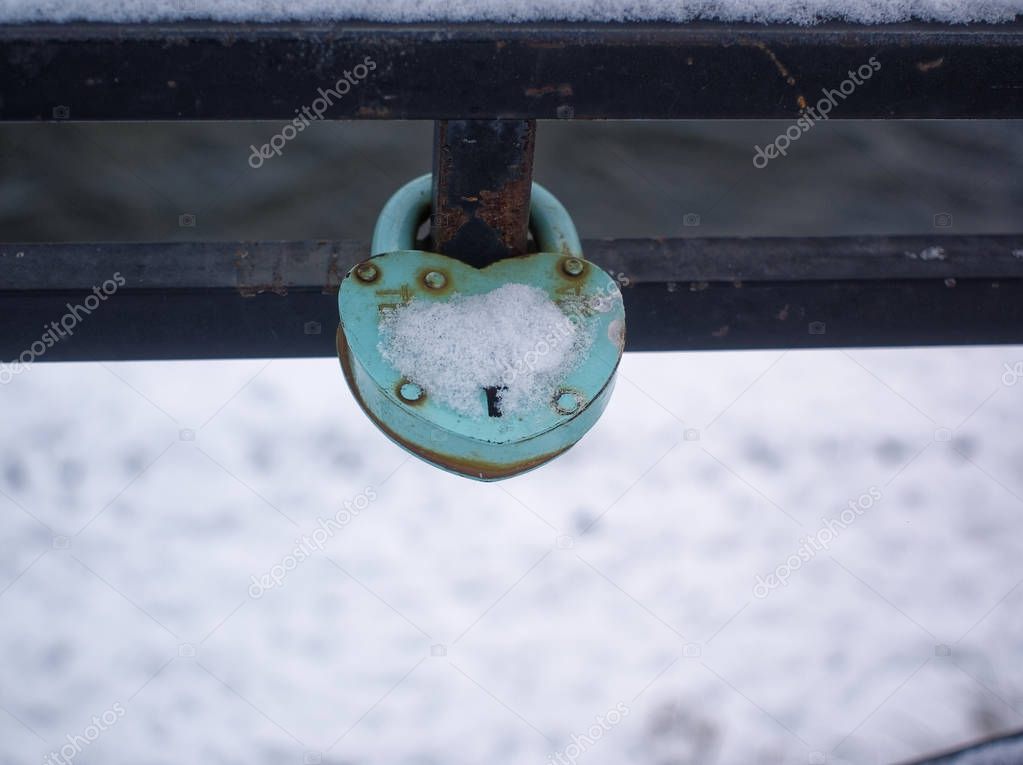 padlock on the fence of the bridge in winter, Mosco