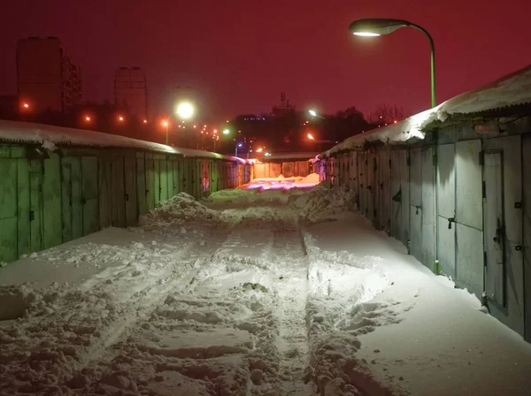 garage for cars in winter evening, Moscow