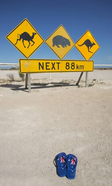 A pair of thongs and an iconic Australian road sign for Australia Day.