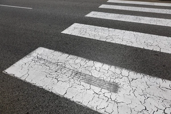 A skid mark on a zebra crossing, road safety concept.