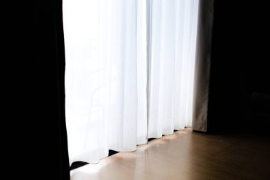 Dawn of light through a translucent white curtains in my bedroom.