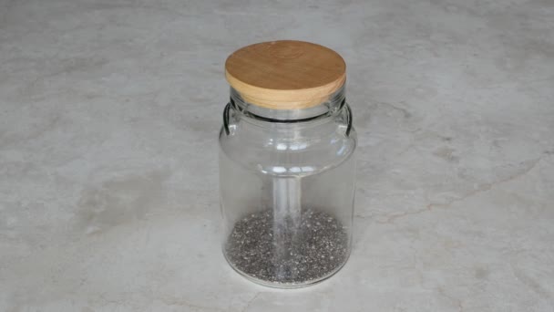 Chia Seeds Glass Jar Chia Seeds Poured Top Closed Glass — Stock Video