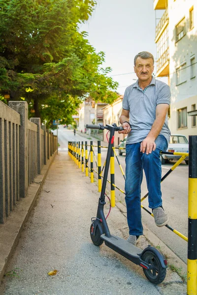 Senior Man Sitting Fence Sidewalk Holding Electric Kick Push Scooter — Stock Photo, Image