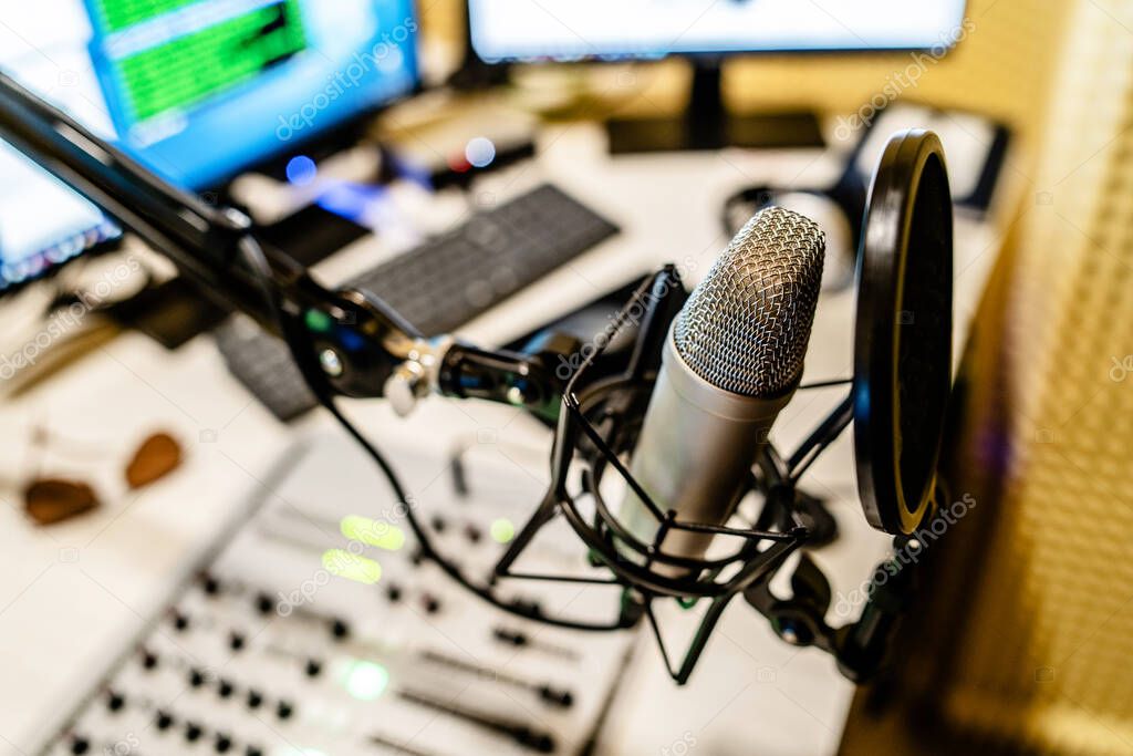 Microphone at the radio station studio broadcasting news