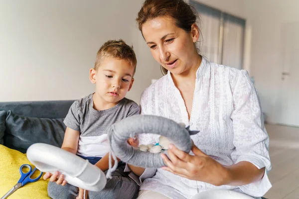 Mother Son Sofa Home Looking Homemade Craft Decoration Caucasian Boy — Stock Photo, Image