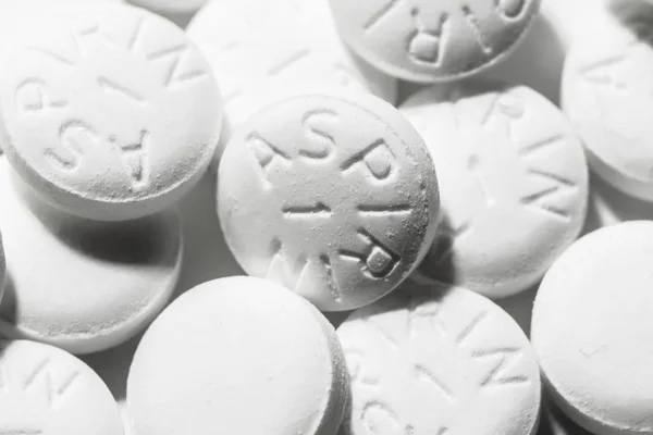 Macro shot of white aspirin pills — Stock Photo, Image