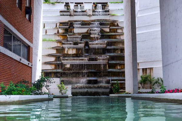 Spa healthy water and artificial waterfall building in resort. Source of healthy and healing water