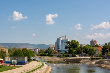 Nis, Serbia - August 28, 2019: Citiscape of river Nisava and a quay promenade on summer sunny day in the city of Nis, Serbia clipart