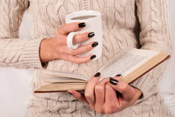 Female Holding Tea Cup Reading Book Sweater Close — Stock Photo, Image