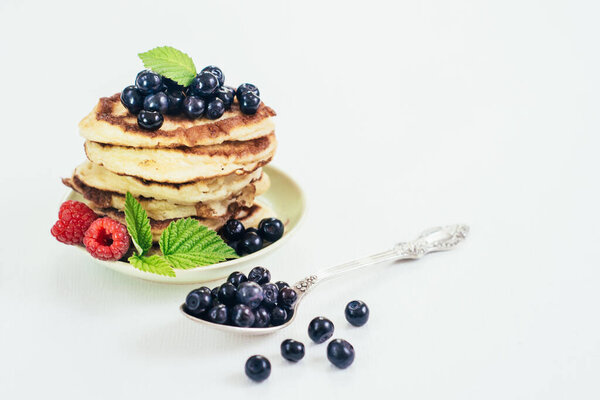 Sweet pancakes with blueberry. Copy space