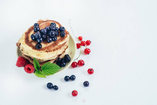 Sweet pancakes with blueberry. Copy space